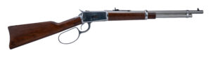 Lever-action rifle with wooden stock on white background
