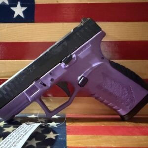 Purple handgun displayed against American flag background
