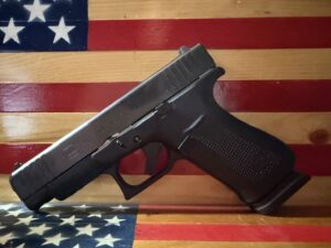 Black handgun on American flag background