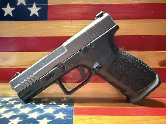 Handgun displayed against American flag background