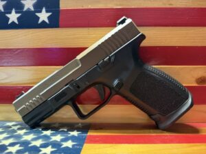 Handgun displayed against American flag background