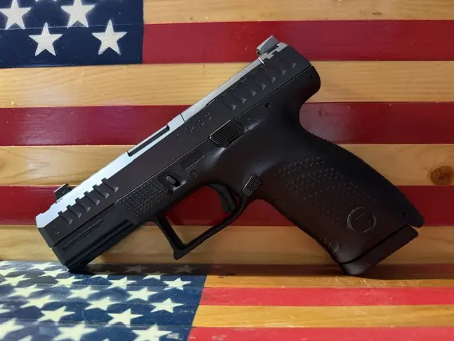 Black semi-automatic handgun on American flag