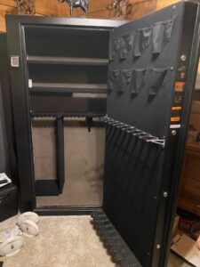 Open gun safe with shelves and rifle rack