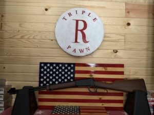 Rifle displayed in front of American flag