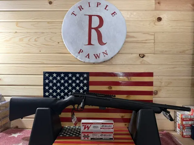 Shotgun on display with American flag backdrop