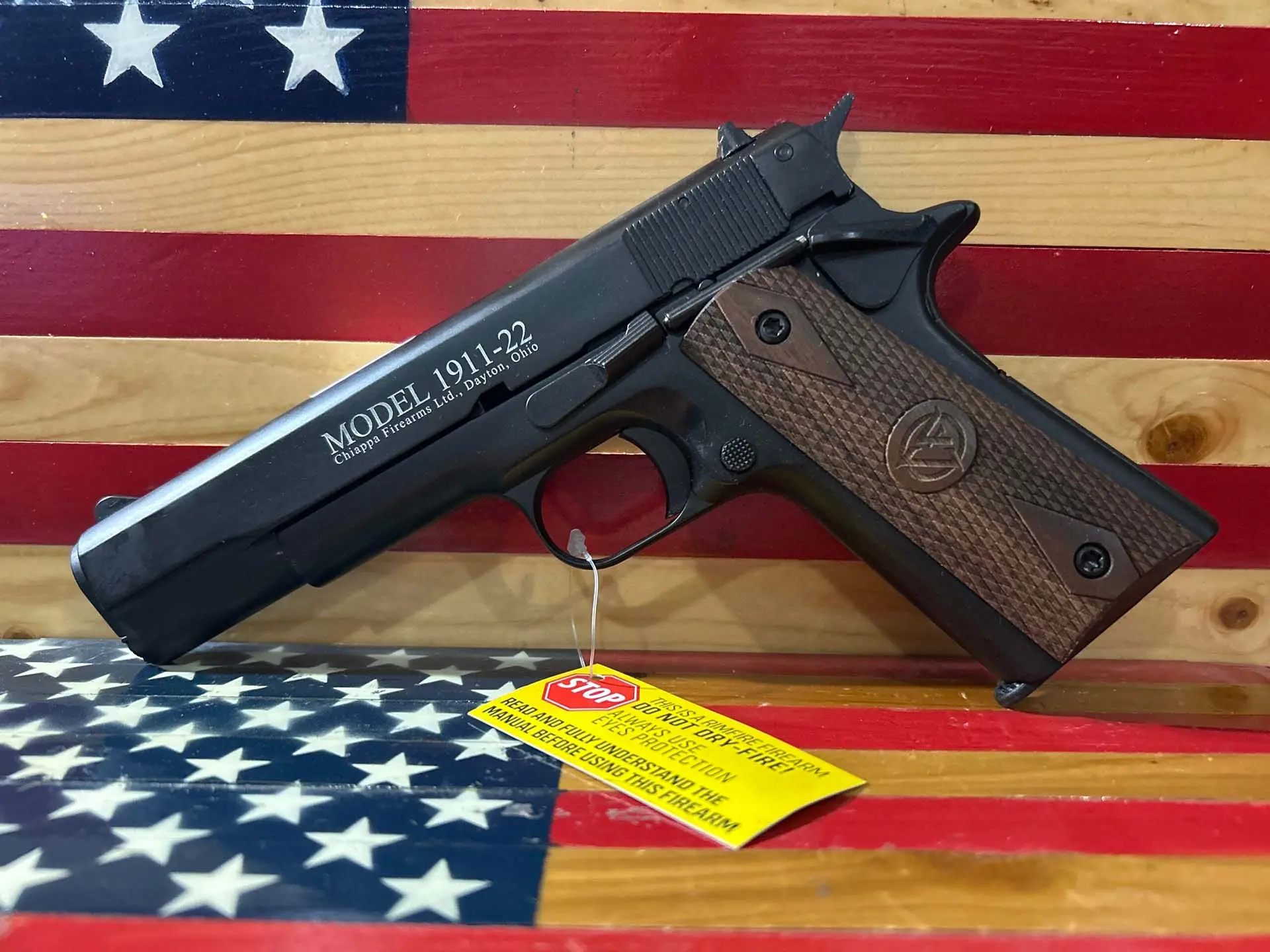 Chiappa Model 1911-22 handgun on American flag