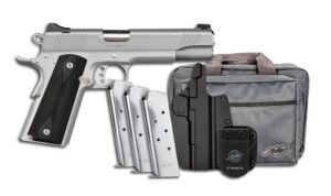 Silver Kimber .45 ACP pistol with magazines and holster